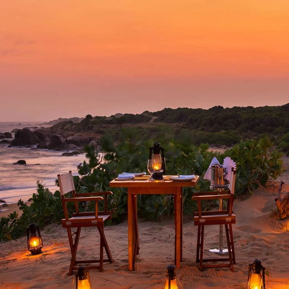 A table on the sand at Kirinda. Candles, the sea, and no one at the next table.